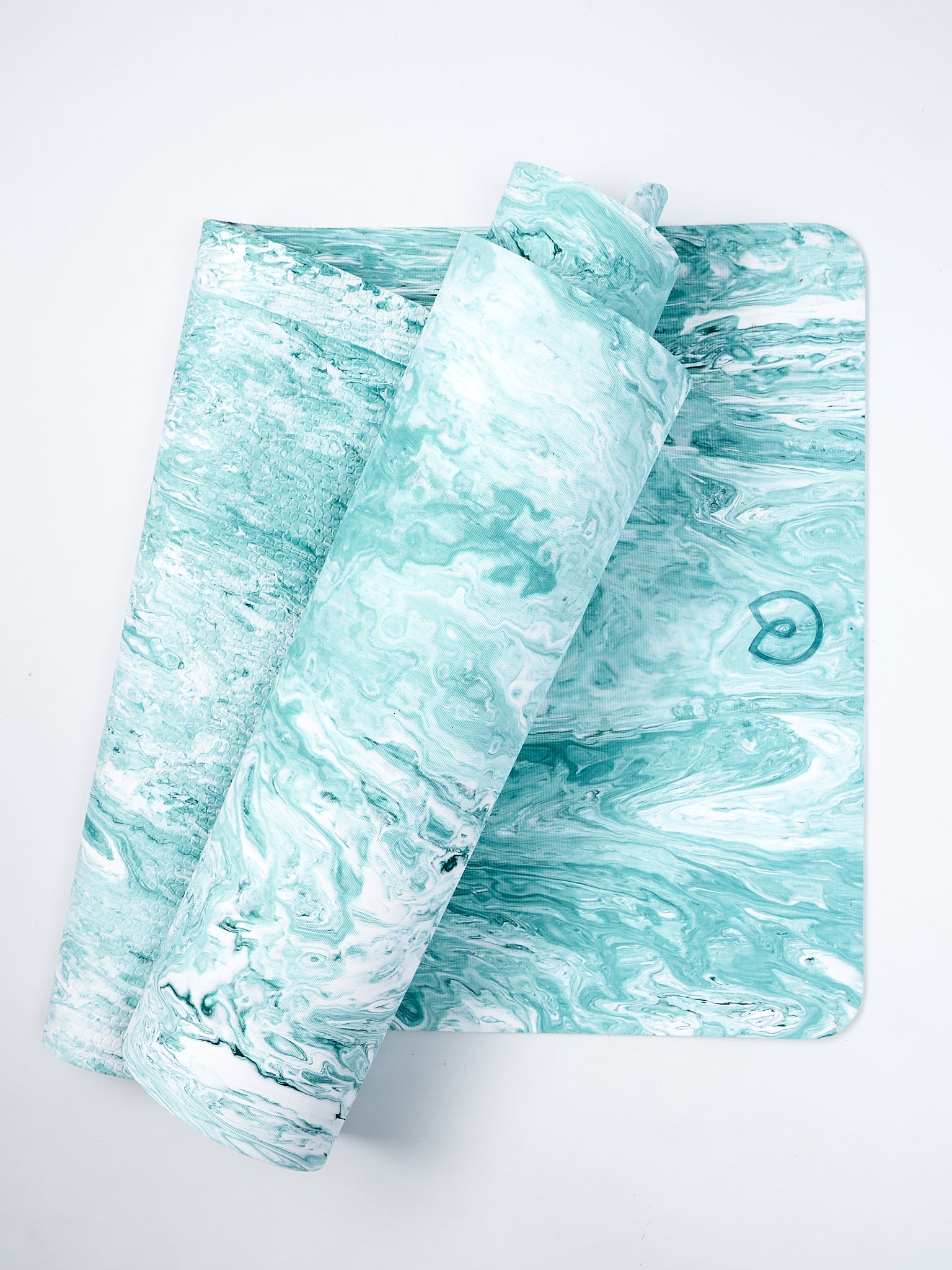 Aqua blue marbled yoga mat partially rolled, with non-slip texture, side shot against a white background.