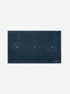 Navy blue Yoga Design Lab yoga mat with cosmic starry pattern, eco-friendly non-slip surface, image shot from the front showing the full design