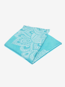 Turquoise yoga mat with mandala pattern, textured non-slip surface, folded yoga mat side shot on white background.