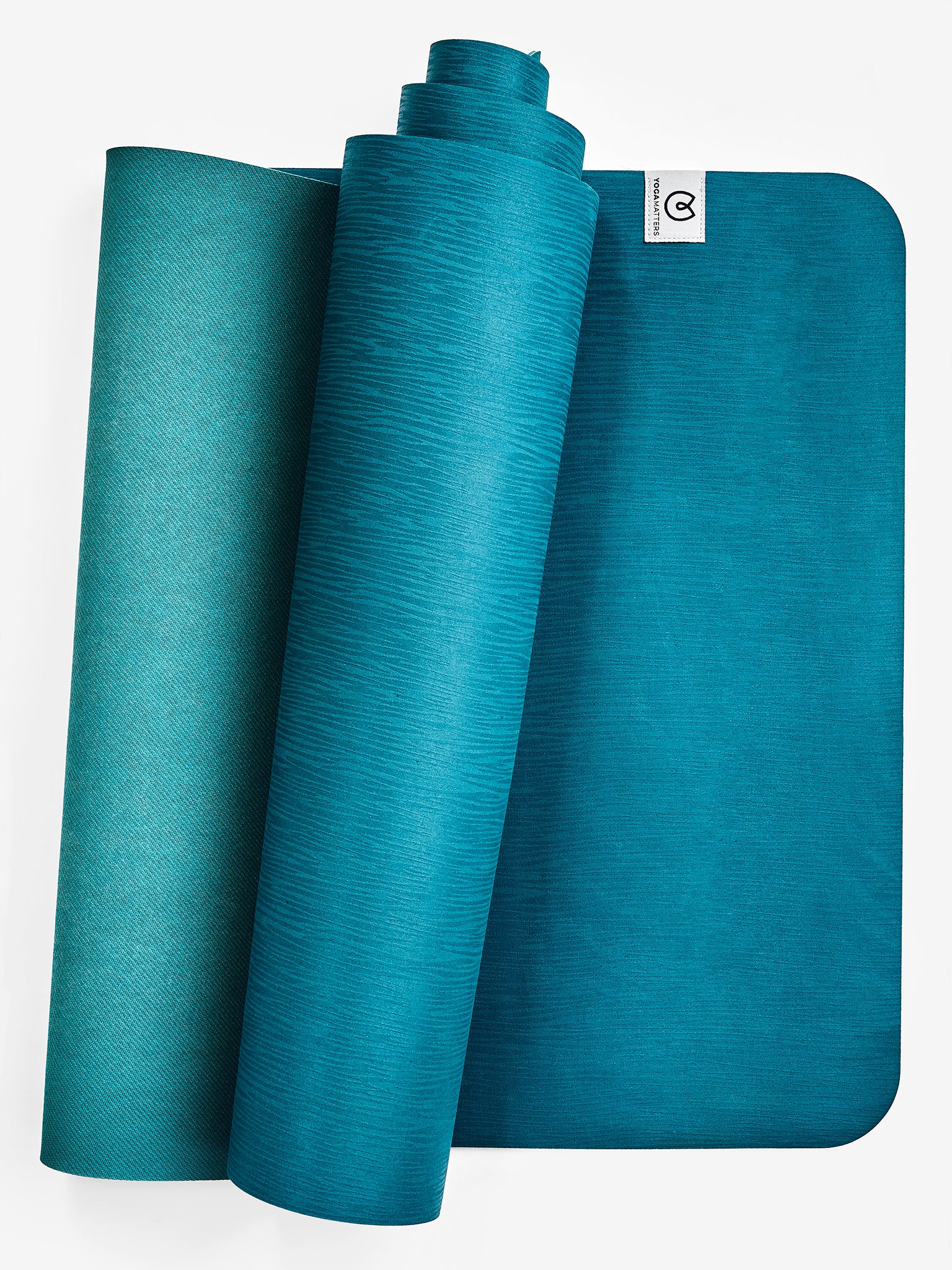 Teal textured yoga mat rolled and unrolled, non-slip surface, eco-friendly material, front view with visible brand logo, fitness and exercise accessory