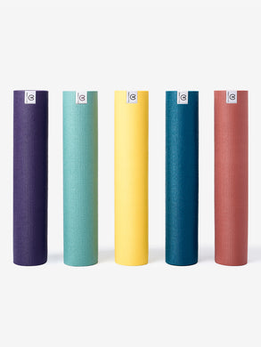 Five rolled yoga mats from front view, in various colors including purple, green, yellow, blue, and red, with textured surface and visible brand logos.