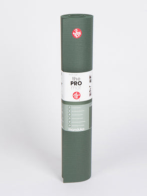 Manduka PRO Yoga Mat rolled up in sage green color, eco-friendly high-density cushion, non-slip fabric finish, front view with logo and product label visible.