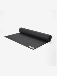 Black premium yoga mat partially rolled up showing brand label with neutral background, high-quality, non-slip, thick exercise mat, side angle view