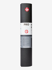 Manduka PROlite yoga mat in charcoal color, textured non-slip surface, durable and lightweight, eco-friendly material, front view with logo visible
