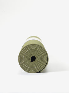 Green yoga mat rolled up front view isolated on white background.