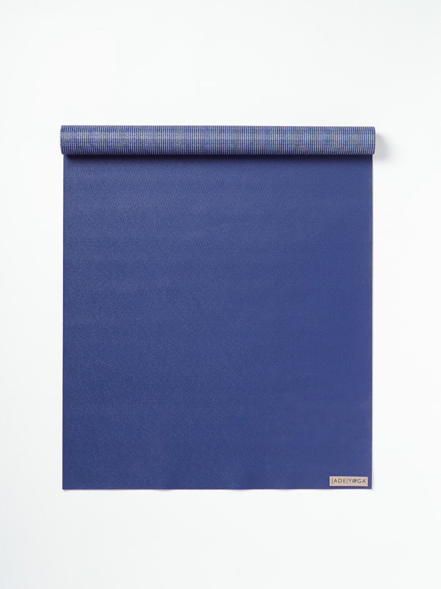 JadeYoga royal blue yoga mat, texture detail, non-slip surface, eco-friendly natural rubber, professional yoga gear, front view on white background.