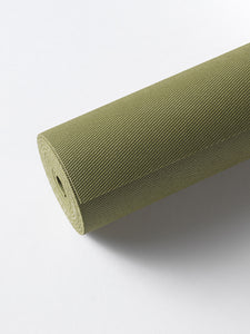 Green textured yoga mat rolled up on a white background, side view, no visible brand, eco-friendly material, fitness accessory.