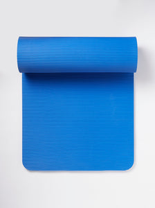 Blue textured yoga mat partially rolled up on white background, top view, non-slip exercise mat for fitness and meditation, studio shot.