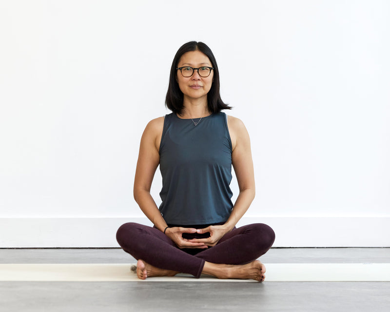 Person sitting in cross legged position