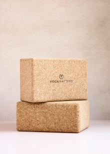 Two cork yoga blocks stacked on a light background with 'YogaMatters' branding.