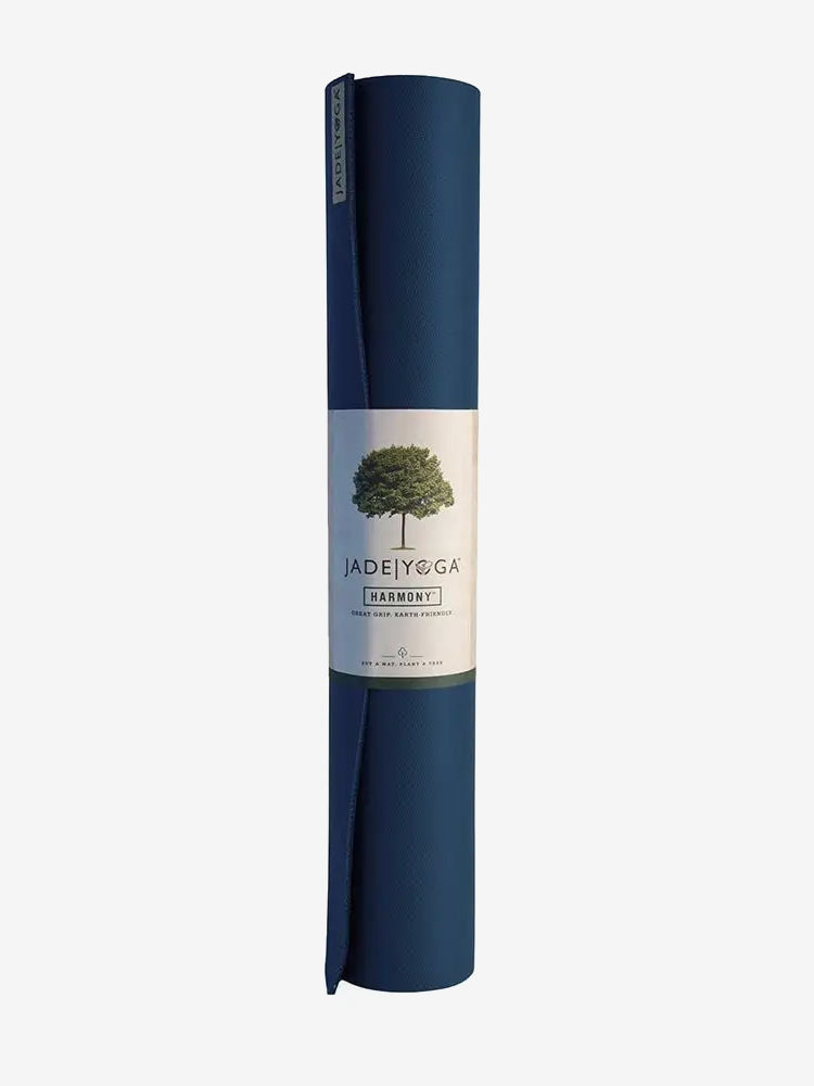 Jade Yoga Harmony Professional Yoga Mat, Navy Blue color, rolled up yoga mat with label, front view on white background.