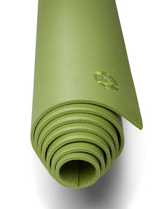 Green textured yoga mat rolled up with brand logo visible, front angle close-up view.