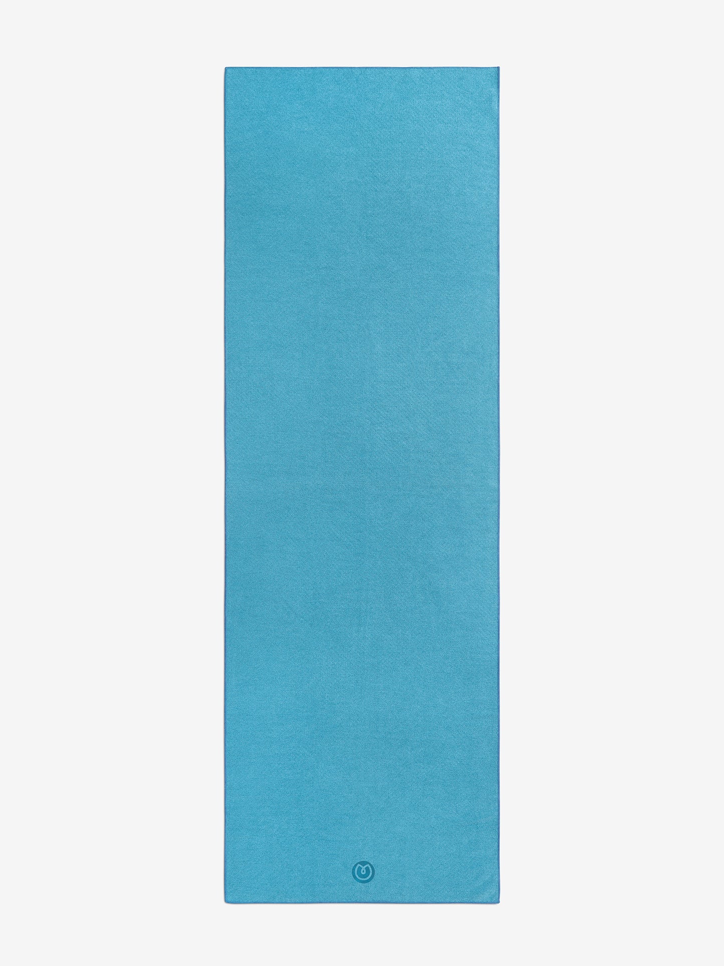 Blue yoga mat front view texture detail with brand logo visible on bottom corner, non-slip surface, thick cushioning for comfort and alignment, isolated on white background.