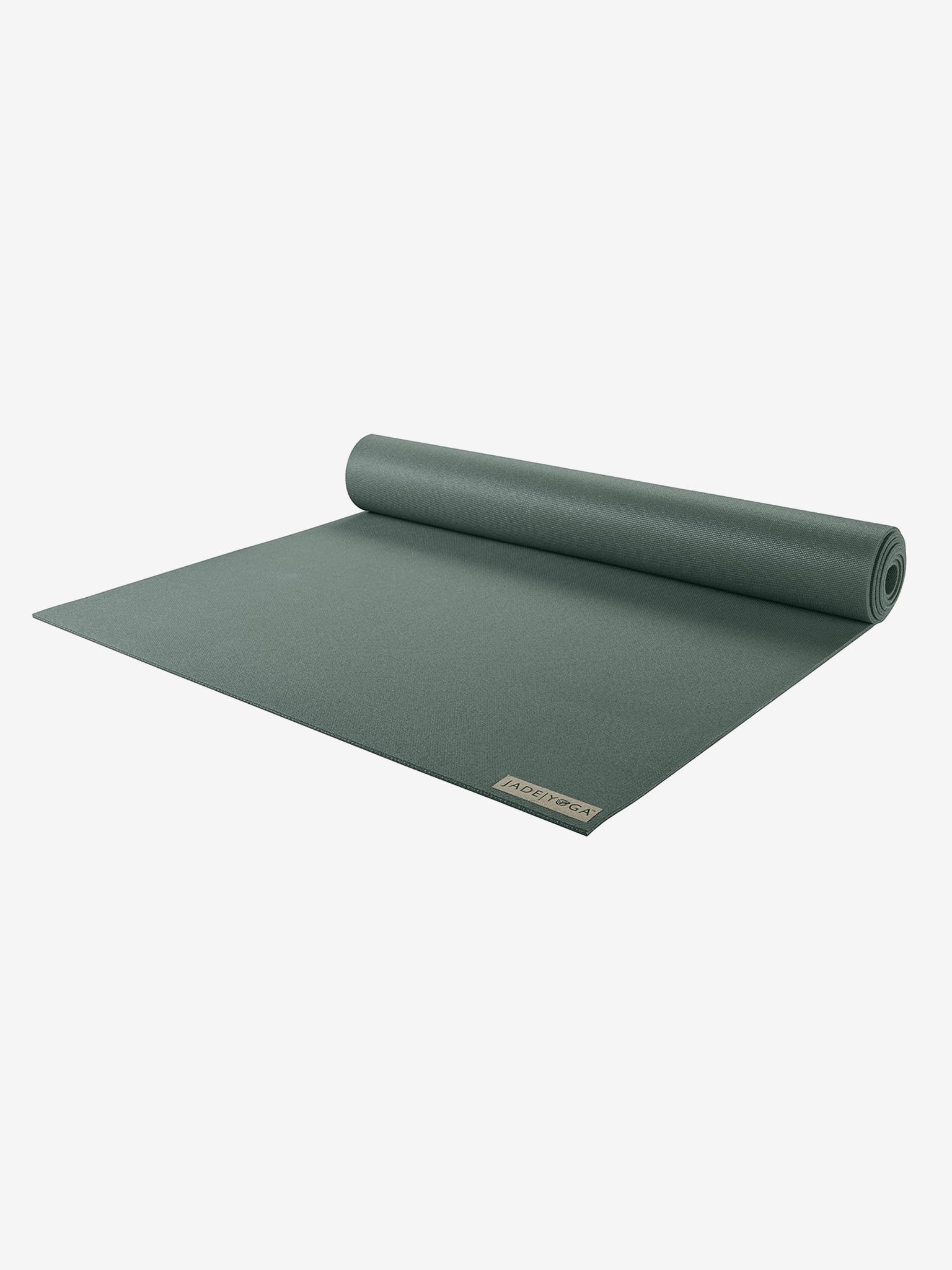 Green Jade Harmony yoga mat by Manduka, rolled halfway, front view on white background