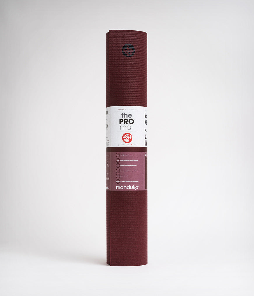 Manduka PRO Yoga Mat in Burgundy Color Front View with Packaging on a White Background