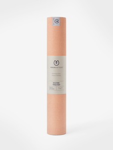 Yogamatters Eco Rise peach-colored yoga mat rolled up front view on white background