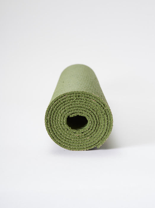 Green yoga mat rolled up front view on a white background