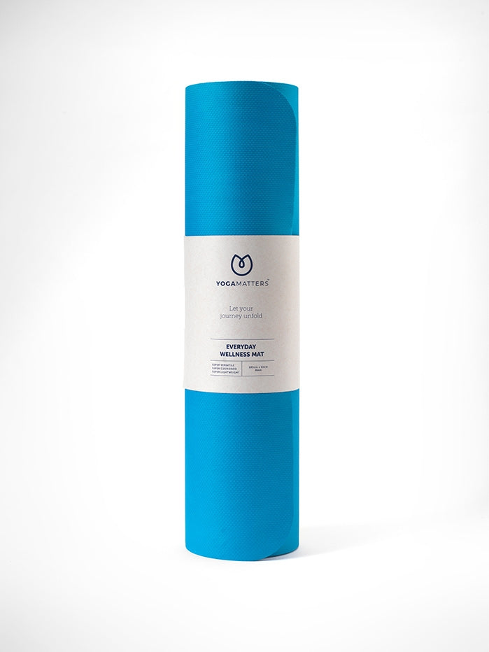 Yogamatters blue yoga mat rolled up, front view on white background, textured non-slip surface, Everyday Wellness Mat.