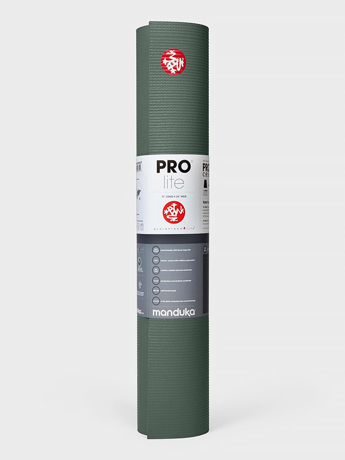 Manduka PROlite green yoga mat rolled up front view with logo and product information label