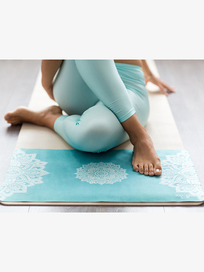 https://www.yogamatters.com/cdn/shop/products/yoga-lab-design-mandala-turquoise-hand-towe-by-cecile-lifestyle.jpg?v=1686667831