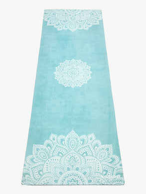 Teal yoga mat with white mandala design, non-slip texture, eco-friendly material, full-length front view